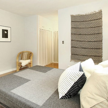 Wall Hanging, Cross Blanket, Rattan Chair and B&W Photography