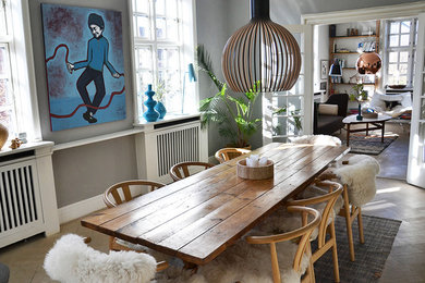Inspiration for a mid-sized scandinavian dining room in Copenhagen with grey walls, medium hardwood floors and beige floor.