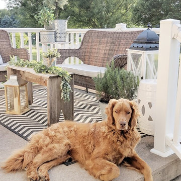 Sunbrella patio seat cushions create neutral backdrop on deck