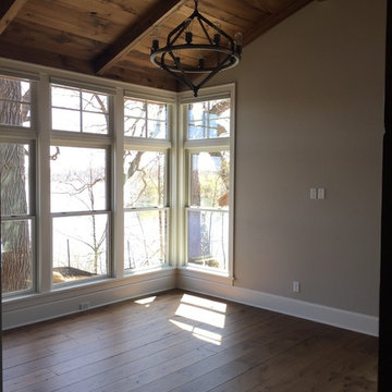 Antique Pine Flooring and Paneling in a Sunlit Corner Room