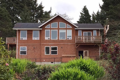 Inspiration for a mid-sized craftsman brown two-story wood exterior home remodel in Portland with a shingle roof