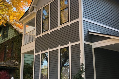 Inspiration for a transitional gray two-story wood exterior home remodel in Indianapolis with a shingle roof