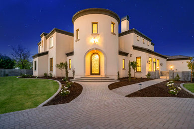 Large southwestern two-story house exterior idea in Phoenix