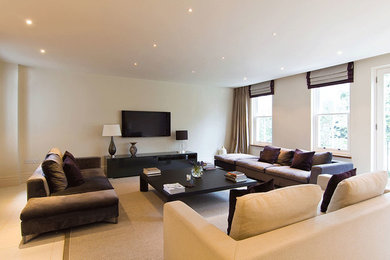 Living room - large contemporary open concept porcelain tile and beige floor living room idea in Other with a wall-mounted tv, beige walls and no fireplace