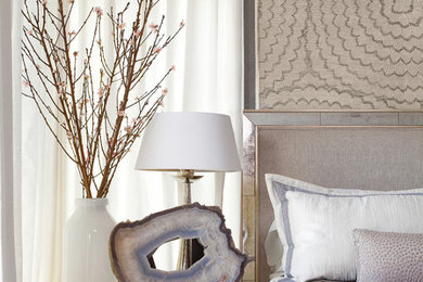 Inspiration for a large transitional guest bedroom in Austin with beige walls and carpet.