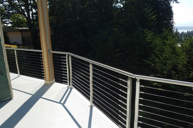 Deck - large modern backyard deck idea in Seattle with no cover