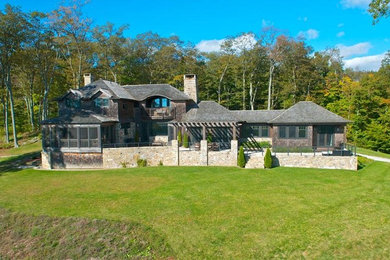 Example of an arts and crafts exterior home design in Boston