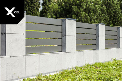 Concretely Black. Conrete and aluminum fence
