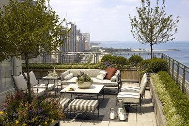 This is an example of a traditional rooftop and rooftop deck in Chicago with no cover.