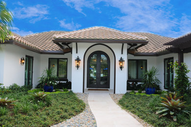 Example of a trendy home design design in Miami