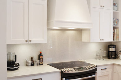 Example of a transitional kitchen design in Montreal