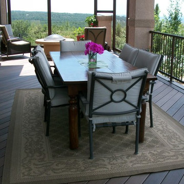 Custom Composite Deck with Gable Deck Cover, Glass Windbreak, and Custom Iron Ra