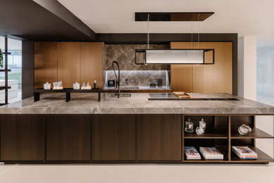 Inspiration for a contemporary open plan kitchen in Other with dark wood cabinets and with island.