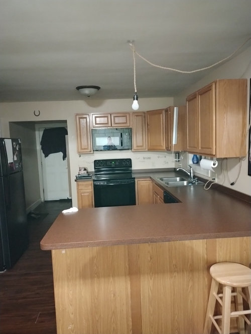 Plug in pendant lights over peninsula