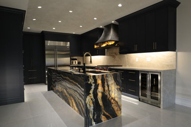 This is an example of a large traditional u-shaped kitchen/diner in Toronto with a submerged sink, louvered cabinets, black cabinets, engineered stone countertops, grey splashback, engineered quartz splashback, stainless steel appliances, ceramic flooring, an island, grey floors and grey worktops.