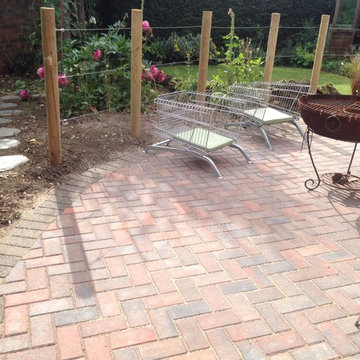 Block paving, wire rope contemporary fencing
