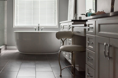Example of a mid-sized transitional master white tile and porcelain tile porcelain tile, gray floor, double-sink and vaulted ceiling bathroom design in Chicago with shaker cabinets, white cabinets, a two-piece toilet, gray walls, an undermount sink, solid surface countertops, gray countertops and a built-in vanity