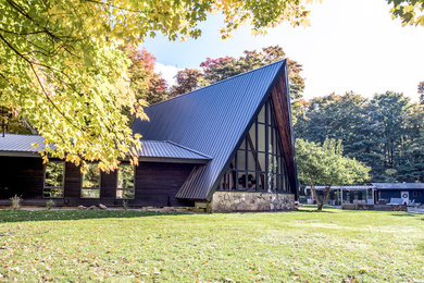 Mid-sized 1950s black two-story wood gable roof idea in Toronto