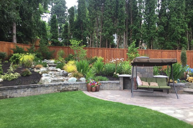 Photo of a large traditional backyard garden in Seattle.