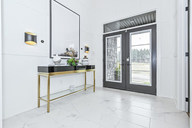 Foyer - large contemporary porcelain tile foyer idea with white walls
