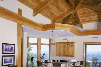 Inspiration for a huge contemporary u-shaped home bar remodel in Charlotte with raised-panel cabinets