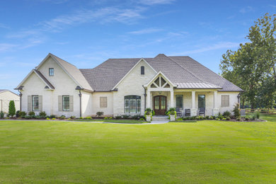 Example of a transitional exterior home design in Little Rock