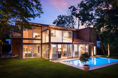 Inspiration for a large scandinavian gable roof remodel in Other