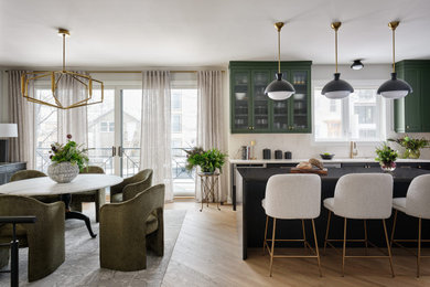 Example of a large transitional light wood floor eat-in kitchen design in Chicago with recessed-panel cabinets, quartz countertops and an island