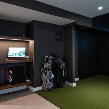 Finished Basement Golf Simulator Room with Built-In Gaming Workstation