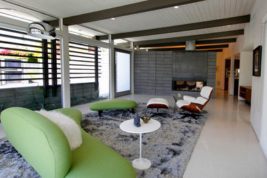 Mid-sized 1960s open concept porcelain tile living room photo in Los Angeles with beige walls, no fireplace and a tv stand
