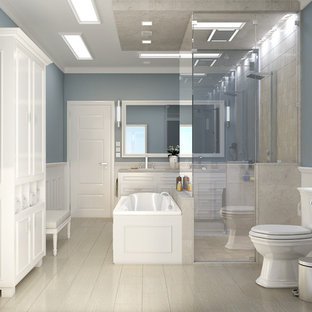 Example of a large minimalist master white tile cement tile floor and beige floor alcove shower design in San Francisco with raised-panel cabinets, white cabinets, a hot tub, a one-piece toilet, blue walls, an undermount sink, quartz countertops and a hinged shower door