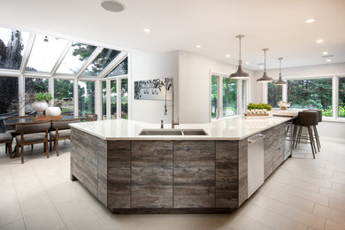Example of a large l-shaped kitchen pantry design in Other with an undermount sink, shaker cabinets, white cabinets, quartz countertops, stainless steel appliances and an island