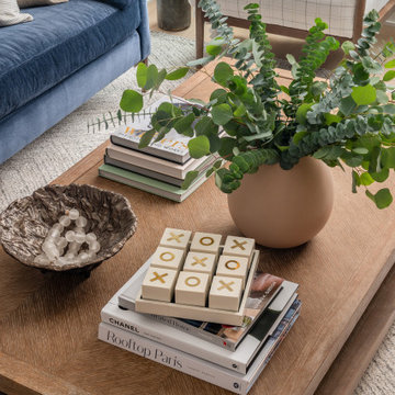 Warm Textural Living Room With Navy Sofa Neutral Grasscloth Wallpaper Woven Shad