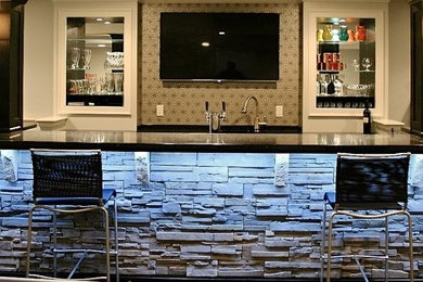 Example of a large minimalist underground dark wood floor, brown floor, coffered ceiling and wainscoting basement design in Philadelphia with white walls and a bar