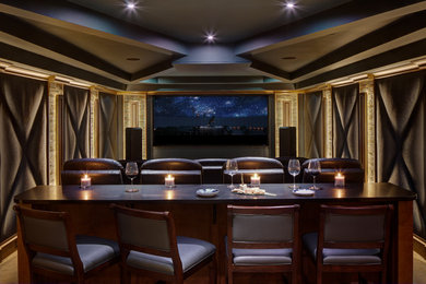 This is an example of a large transitional open concept home theatre in New York with blue walls, porcelain floors, a projector screen and brown floor.
