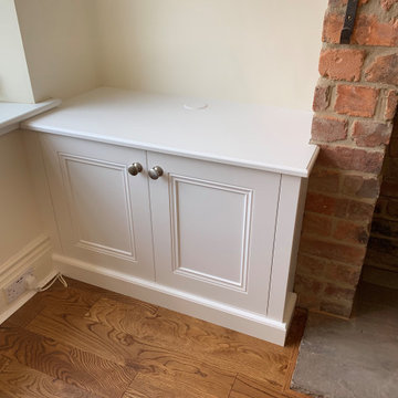 Single Base Cabinet Against a Rough Brick Chimney Breast