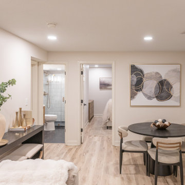 Warm & Inviting Basement Retreat with Custom Bar + Entertainment Center