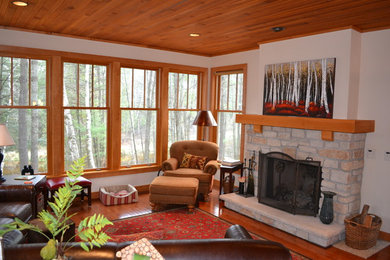Example of a mid-sized mountain style formal and open concept dark wood floor living room design in Other with white walls and no tv