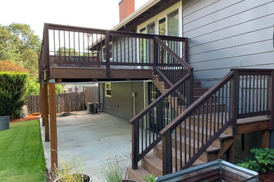 Mid-sized elegant backyard deck photo in Portland with no cover
