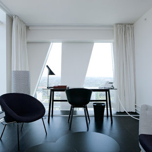 Design ideas for a medium sized modern home office and library in Other with white walls, painted wood flooring, no fireplace and a freestanding desk.