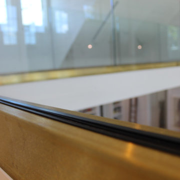 Glass Balustrade with Aluminum Base Rail Finished with Satin Brass Cladding
