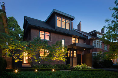 Mid-sized transitional brown two-story brick exterior home idea in Toronto