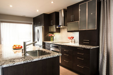 Kitchen - modern kitchen idea in Montreal