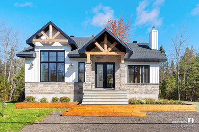 Mid-sized cottage white one-story mixed siding and board and batten exterior home photo in Montreal with a shingle roof and a gray roof