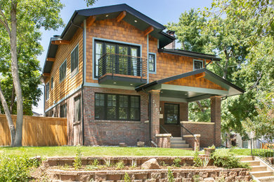 Example of a transitional exterior home design in Denver