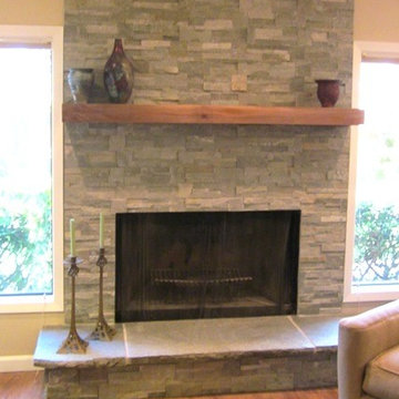 refaced fireplace with black walnut mantle, raised floors with luxury vinyl tile