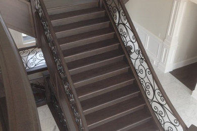 Staircase - large traditional wooden curved wood railing staircase idea in Other with wooden risers