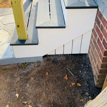 Picture frame deck tread with Azek risers, stringer and underpinning.