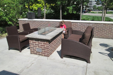 Patio - mid-sized transitional courtyard concrete patio idea in Chicago with no cover