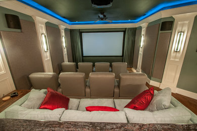 Design ideas for a large traditional enclosed home theatre in Charlotte with a projector screen.